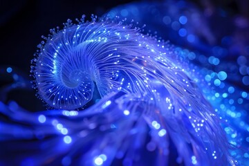 Image constructed from intricately coiled and glowing fiber optics. The fiber optics