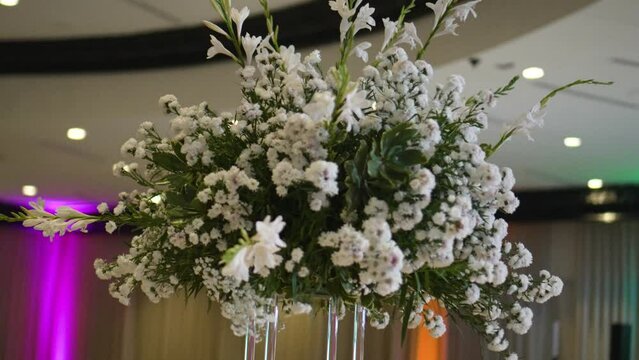 Elegant flower decoration with Gypsophila paniculatas and white roses. Wedding details.