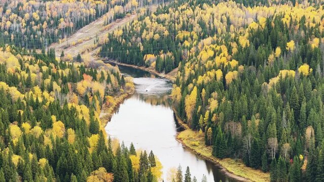Amazing view of the picturesque Usva River in autumn, near the Usva pillars, flowing through a rocky area in the Perm region, unique landforms, stone pillars. Russia 4K