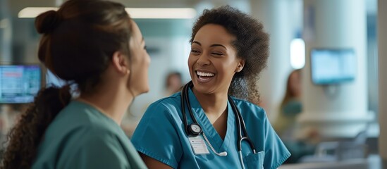 happy expression, two female hospital nurses laughing happily