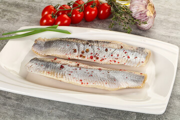 Marinated herring fillet with green onion