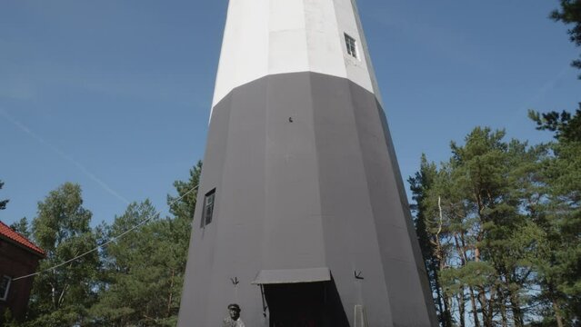 Stilo Lighthouse in Pomeranian Voivodeship against blue sky, Poland - Tilt-up.