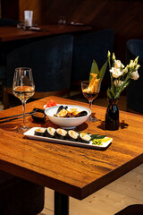 sushi and wine on the table