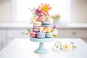 Zelfklevend Fotobehang macaron tower with flowers on a cake stand © studioworkstock