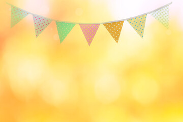 Bunting flag on abstract blurred yellow light background, festive season and celebrate background...