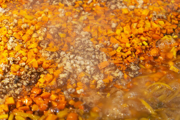 Cooking of plov in the Kazan cauldron at the Central Asian Plov Centre, Tashkent, Uzbekistan