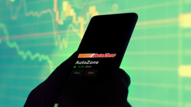 January 15th 2024 Memphis, Tennessee. The logo of AutoZone on the screen of an exchange. AutoZone price stocks, $AZO on a device.