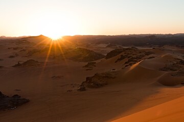 Fototapeta na wymiar View of sunset the Dunes of Tin Merzouga in Tadrart Rouge, Tassili N'Ajjer National Park. Sahara, Algeria, Africa.