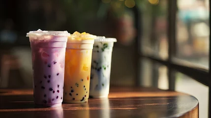 Foto auf Acrylglas Bubble tea set in plastic glasses, variety of tapioca or boba tea in a row. © AnyPic289