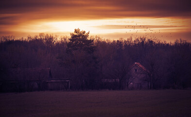 House in sunset. Dark toned photo - 712983684