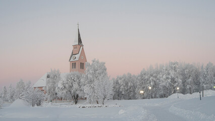 Fototapeta na wymiar Pink church in Arjeplog in December