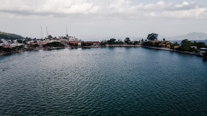 Naklejka premium aerial view, natural tourist atmosphere of Sarangan Lake, Magetan, East Java, Indonesia. Which is a popular tourist attraction.