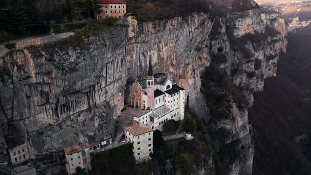 Santuario de la Madonna Della Corona christian monastery in mountains of Italy, aerial drone view