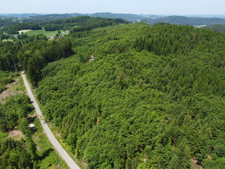 Bavarian forest with fields and meadows, aerial
