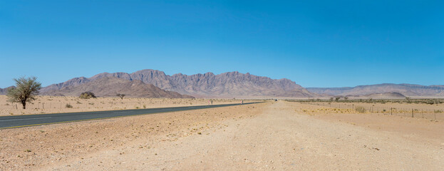 tar road and Naukluftberge mountain range, near Sesriem,  Namibia