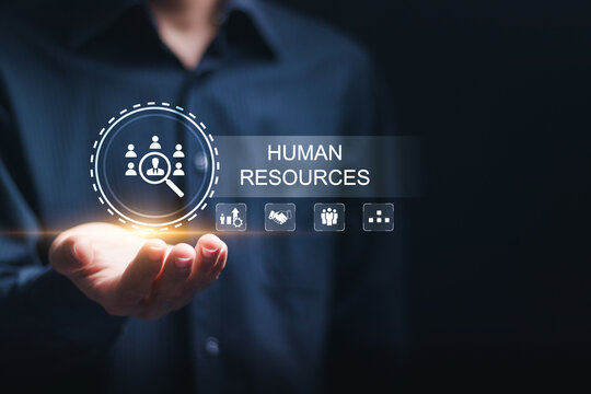 Businessman Hold Virtual HR Word With Human Resources Icon For Recruitment Process To Work Efficiently And Achieve Sustainable Business Success. Team Building. Human Resources HR Management Concept.