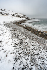 Wintry landscape by the sea in Ekkerøy Norway during the polar night