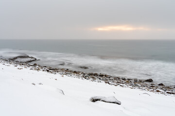 Fototapeta na wymiar Wintry landscape by the sea in Ekkerøya during the polar night, Norway