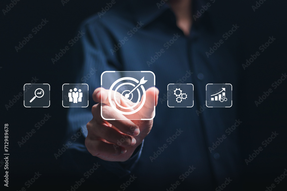 Poster targeting business concept. businessman touching virtual target icon for business objective. strateg