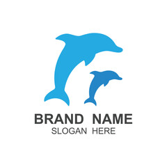 Obraz premium Dolphin logo vector with jumping position .This logo is suitable for travel company, diving or water adventure.