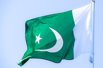 National flag of Pakistan. Pakistan flag against blue sky. Great for news. Waving flag of Pakistan