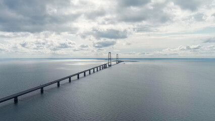 Fototapeta na wymiar Korser, Denmark. Great Belt Bridge (Storeb?lt). Cloudy weather with gaps, Aerial View
