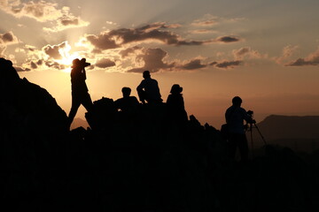 group of people at sunset