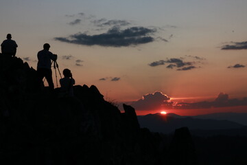 silhouette of phoographers at sunset