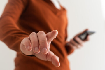 Businessman pressing an imaginary button on bokeh.