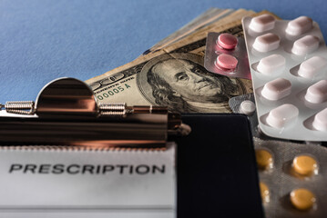 Blue medical background with doctor's prescription, drugs and dollars money
