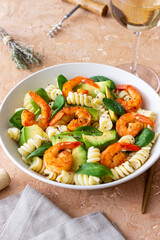 Pasta salad with shrimps, avocado and spinach. Healthy eating. Seafood.