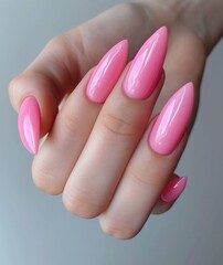 woman's hand holding pink nails