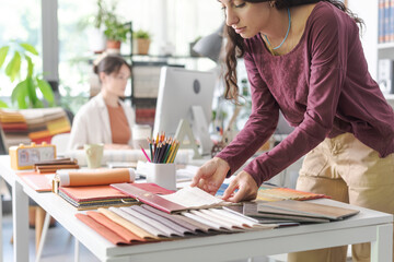 Designer choosing fabric swatches for her project