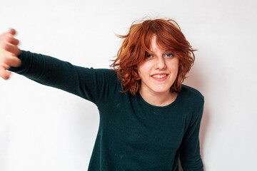 portrait of a pensive teenage girl with red hair with a stylish anime hairstyle