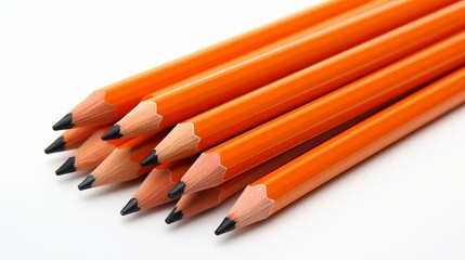 Obraz premium Orange color pencils with white exterior on white background for art and design projects