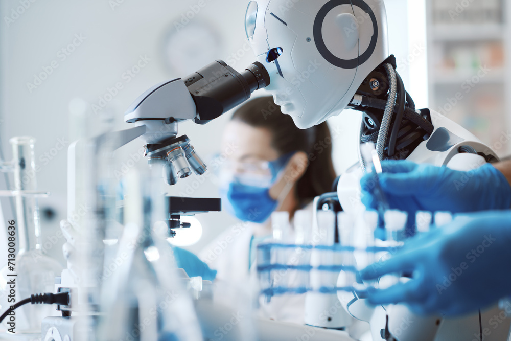 Wall mural scientist and humanoid robot working together in the science lab