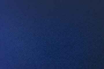 Deep dark shade blue paint on environmental friendly cardboard box paper texture background with...