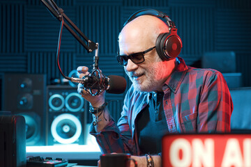 Radio host talking into the microphone
