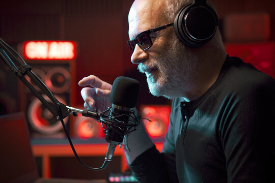 Radio host talking into the microphone