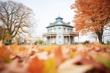 italianate house featuring a belvedere amid a backdrop of autumn leaves - obrazy, fototapety, plakaty