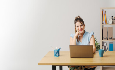 Confident woman connecting with her laptop