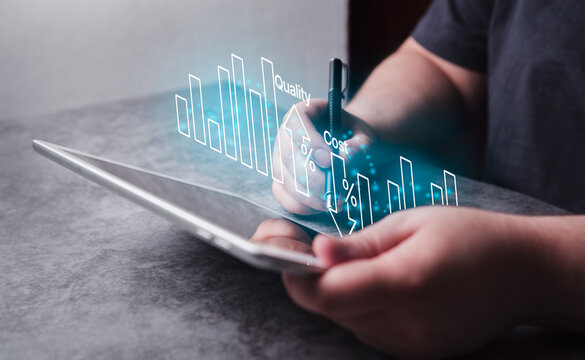Woman use digital tablet for business cost and quality control. Strategy and project management concept. Business woman working with holographic graph of quality control growth and cost reduction.