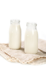 Bottles of milk on a napkin