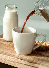 Pouring coffee into a cup