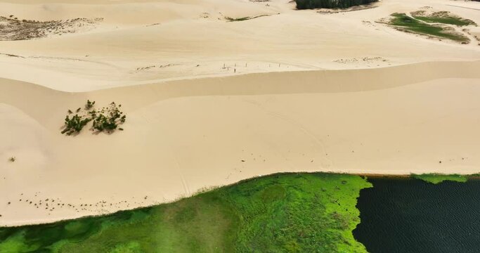 Stark geographical contrast between sand and water near Mui Ne, Vietnam. Mui Ne Desert of Vietnam is a desert in Southeast Asia