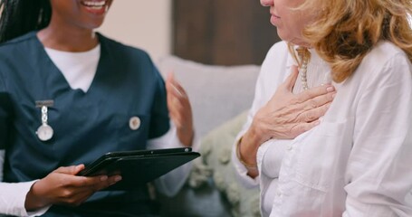 Senior, woman and doctor with tablet for consulting, health advisory or healthcare communication on sofa. Elderly, caregiver or patient for discussion, medical results and expert information on couch