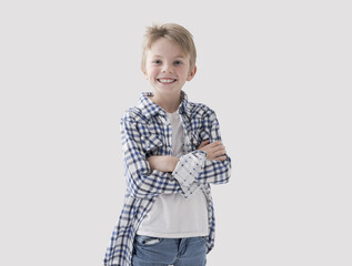 Cute boy posing with arms crossed