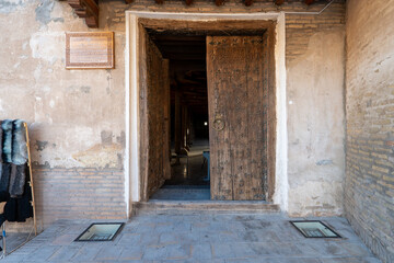 entrance door of Juma Mosque and its wooden columns, in Khiva, Uzbekistan.