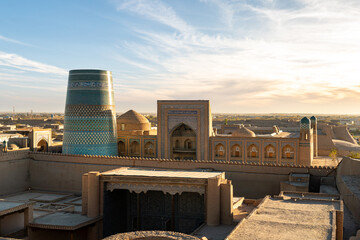 The Kalta Minor is an unfinished minaret against a blue sky background located in Khiva. Kaltaminor
