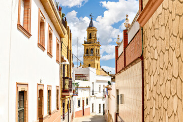Obraz premium View of the bell tower of the church of Santiago de Alcalá de Guadaíra, from San Miguel street. Seville